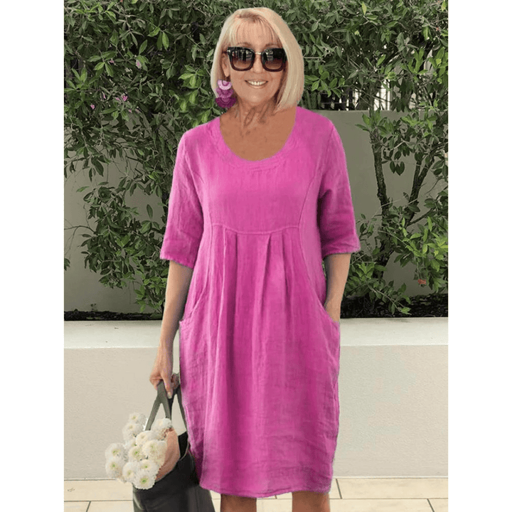 Emma & Rose Manhattan Gabriella summer dress featuring stylish pockets, lightweight fabric, and a vibrant floral pattern.