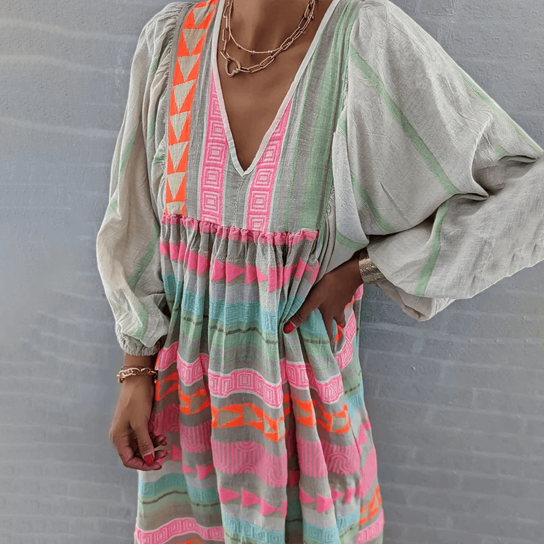 Jessie™ boho dress by Emma & Rose Manhattan with flowy fabric and floral pattern, perfect for casual and summer wear.