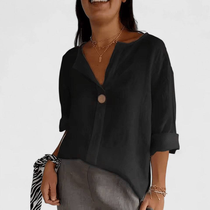 Kianna™ elegant blouse by Emma & Rose Cape Town, featuring a stylish, fitted design with intricate detailing and a soft fabric appearance.