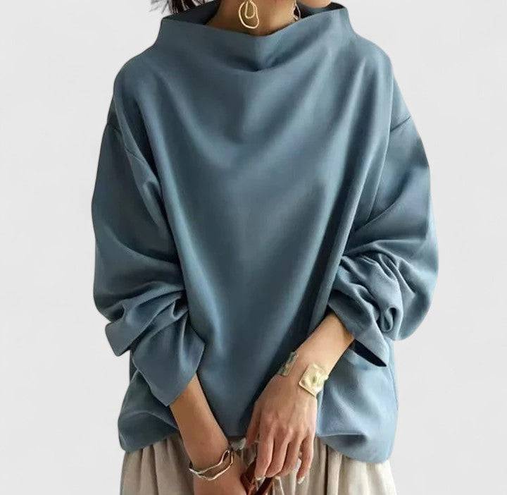 Orivela™ elegant top by Emma & Rose Cape Town featuring a stylish, draped design in soft fabric, displayed on a neutral background.