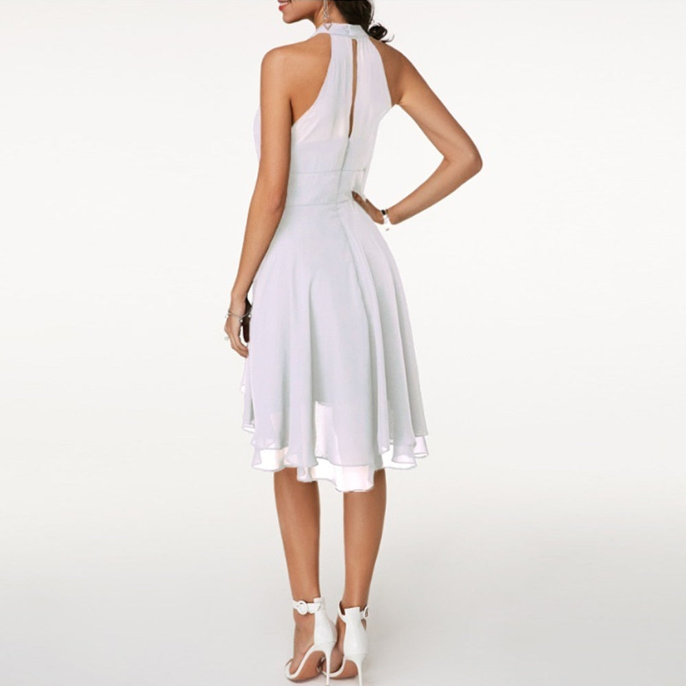 Emma | Elegant short dress for women with halter neck and flowing fall
