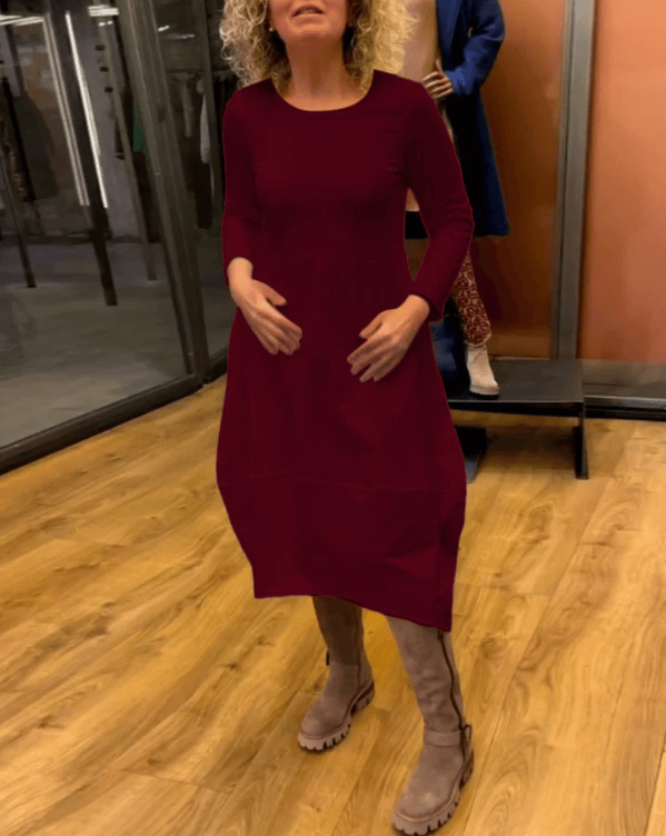 Black Clara™ midi dress with pockets by Emma & Rose Manhattan, featuring a sleek design and elegant fit.