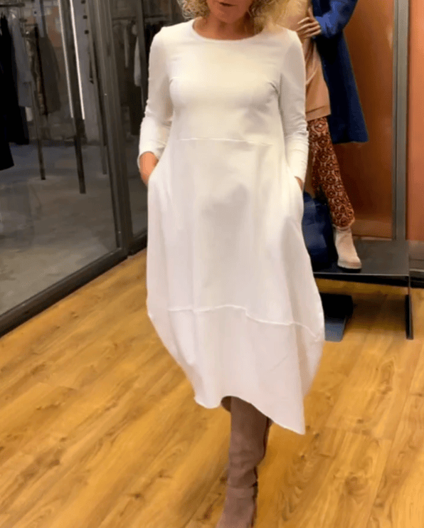 Black midi dress by Emma & Rose Manhattan with pockets, featuring a stylish and elegant design perfect for versatile occasions.
