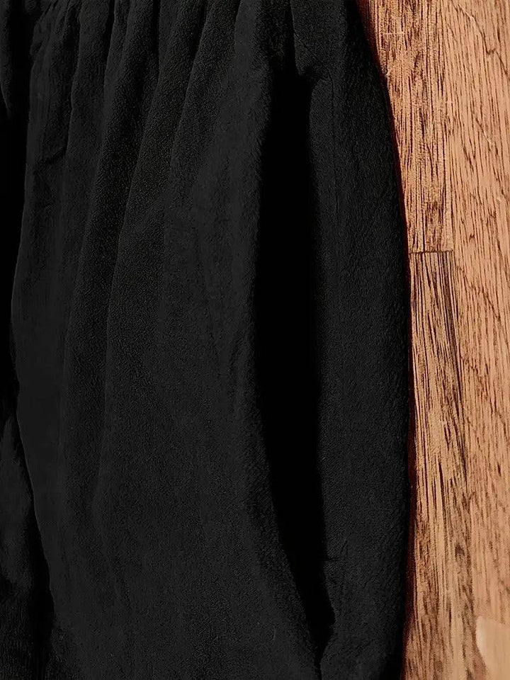 Emma & Rose Manhattan Elisa™ dress pocket in black fabric, showing detailed close-up of the stylish, functional pocket design.