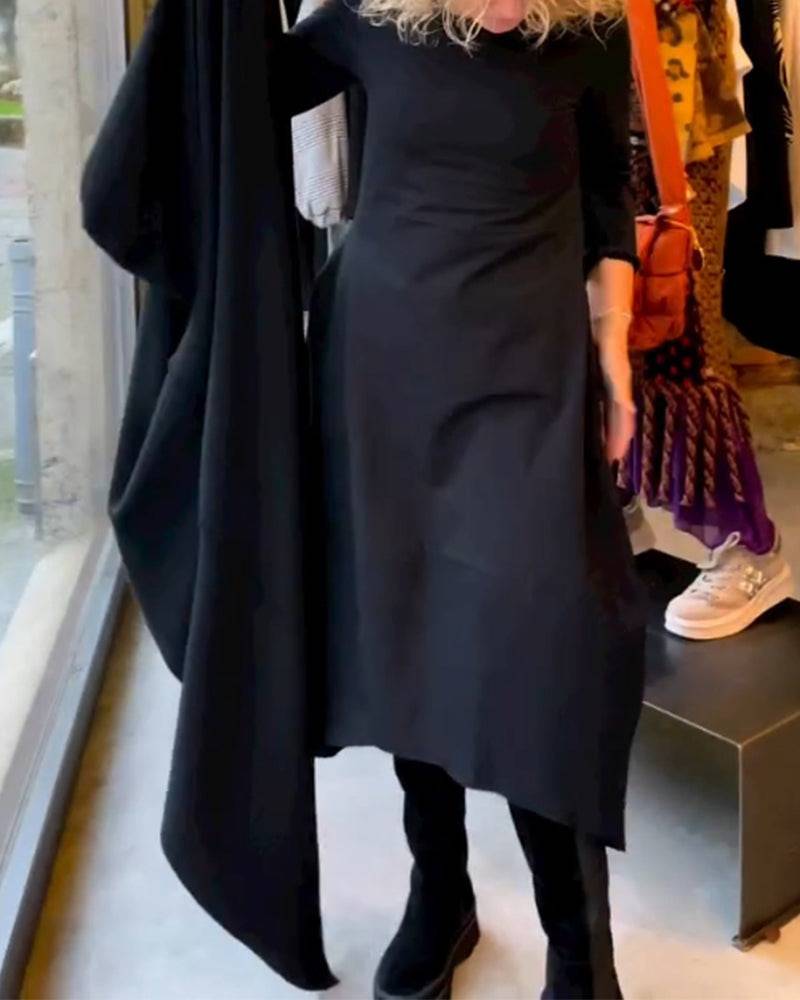 Black Clara™ midi dress with pockets from Emma & Rose Manhattan, shown on a model highlighting its stylish fit and design.