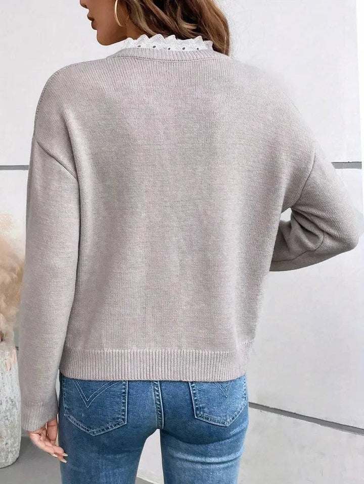 Kaitlyssa™ elegant sweater by Emma & Rose Cape Town, soft knit fabric in a stylish, fitted design shown in the image.