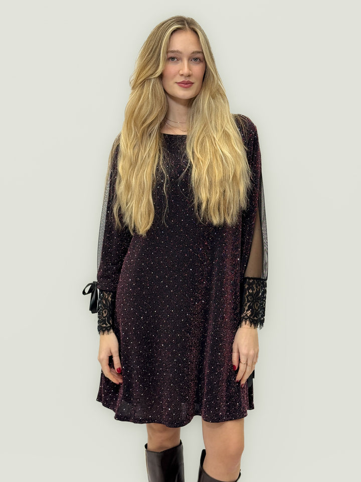 Emma & Rose Cape Town Bridget™ Brilliant Dress in black with soft luxurious fabrics and elegant bows.