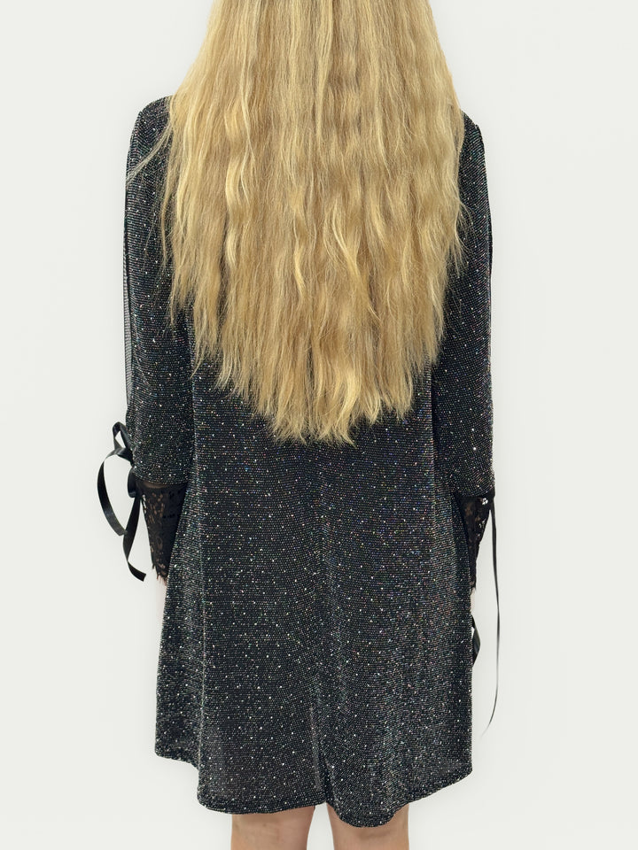 Emma & Rose Cape Town Bridget™ Brilliant Dress in black with soft luxurious fabrics and decorative bows.