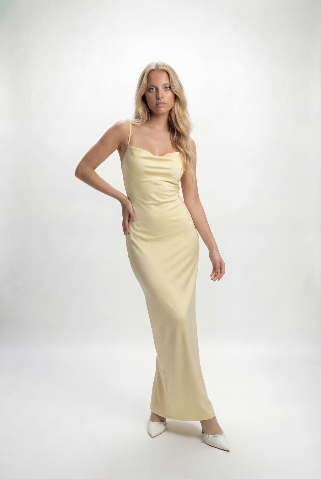 Light blue fitted long dress with thin straps by Emma & Rose Cape Town, elegant and flowing for formal occasions.