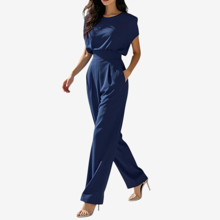 Beige Wiera™ jumpsuit belt by Emma & Rose Cape Town, stylish accessory with a sleek design, shown on a model.