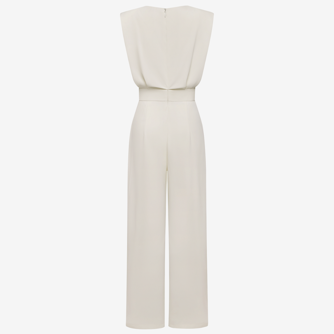 Beige Wiera™ jumpsuit belt by Emma & Rose Cape Town, adjustable fabric belt with metal buckle, styled on a beige jumpsuit.