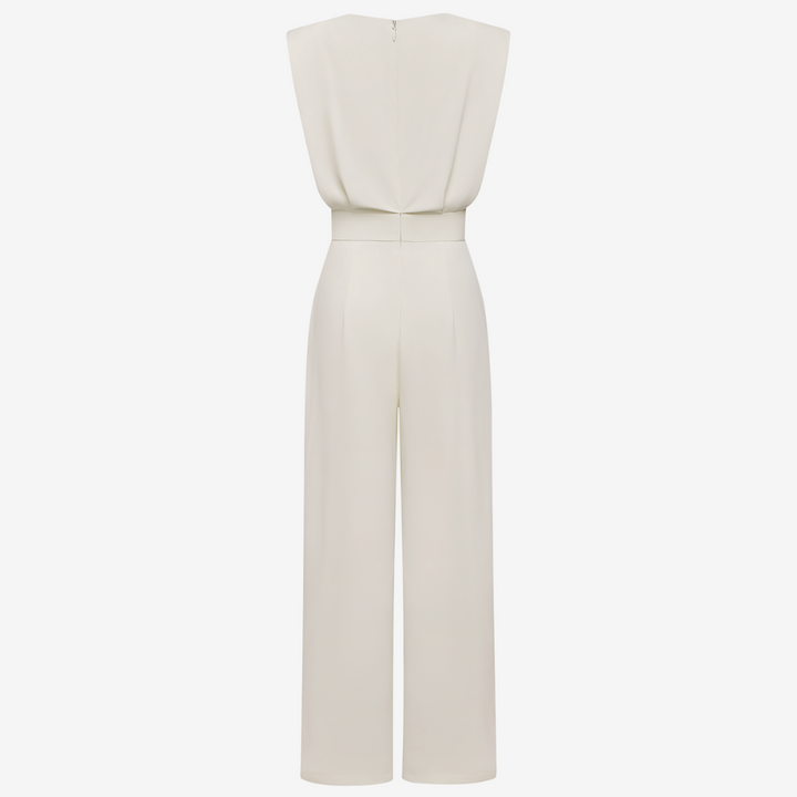 Beige Wiera™ jumpsuit belt by Emma & Rose Cape Town, adjustable fabric belt with metal buckle, styled on a beige jumpsuit.