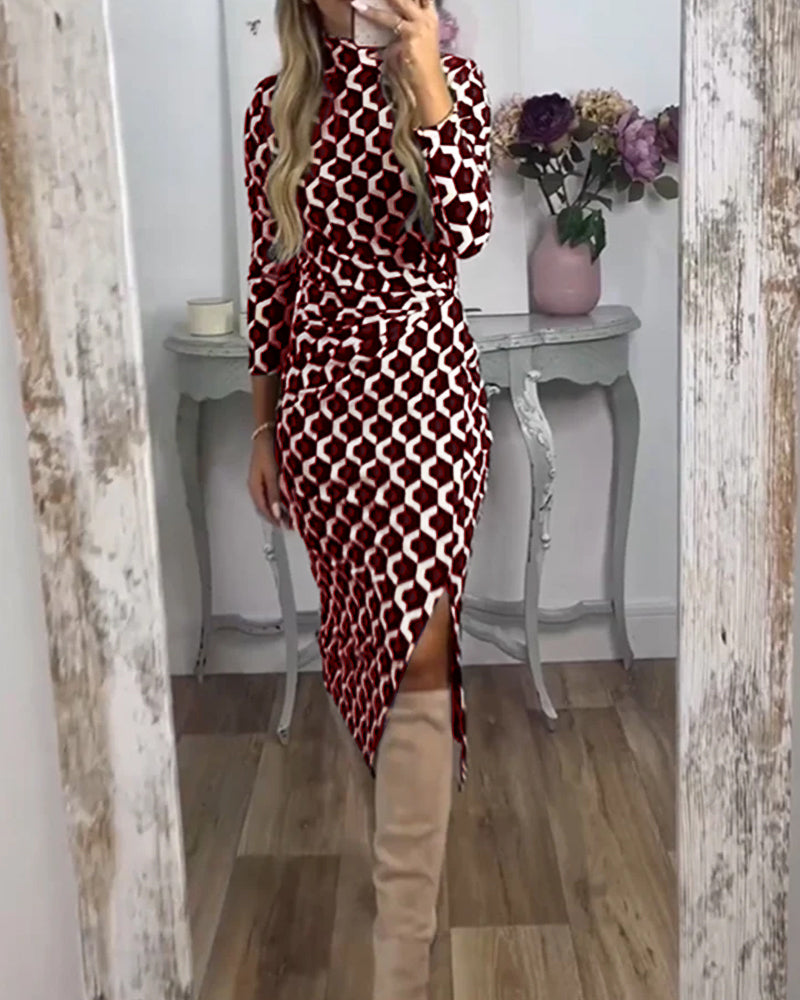 Black dress with a slit and fish scale print by Emma & Rose Cape Town, featuring a sleek silhouette and detailed pattern.