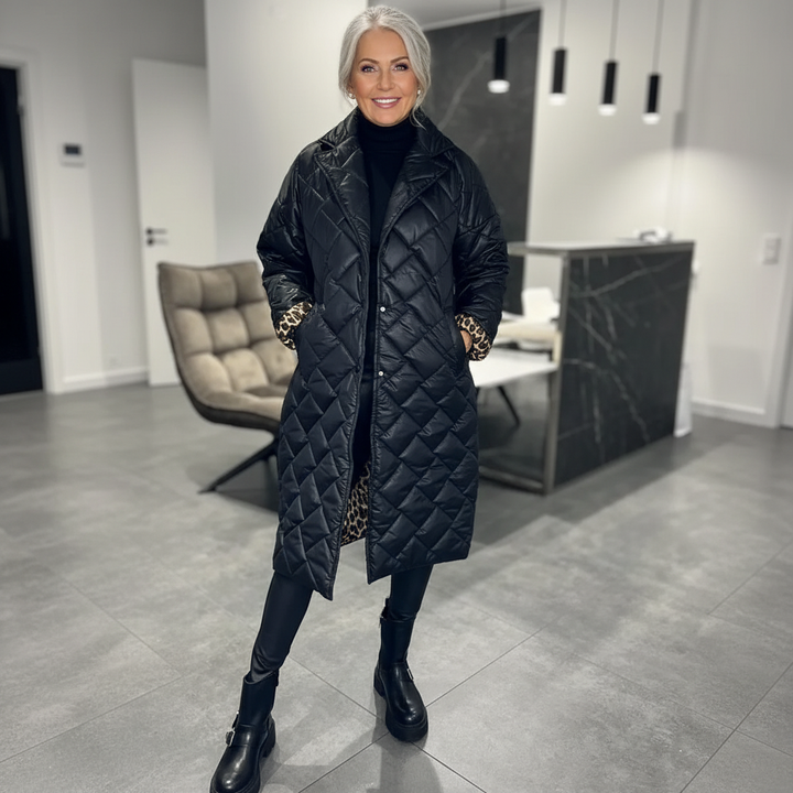 Black Livara™ quilted coat by Emma & Rose Cape Town, showing its soft, comfortable design with a quilted pattern and cozy fit.