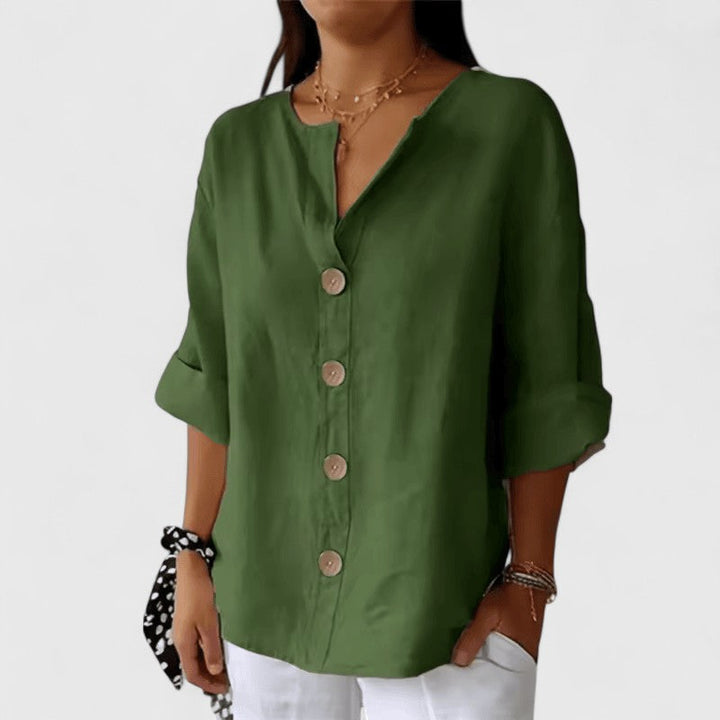 Black Cathlyn™ elegant blouse by Emma & Rose Cape Town, featuring a stylish, tailored design and lightweight fabric.