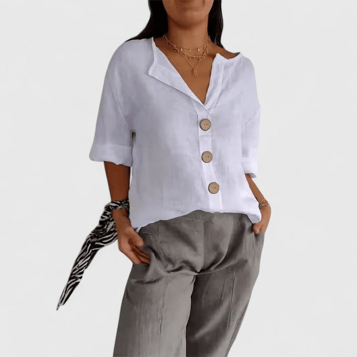 Black Cathlyn™ elegant blouse by Emma & Rose Cape Town, featuring a stylish, fitted design with long sleeves and a classic collar.