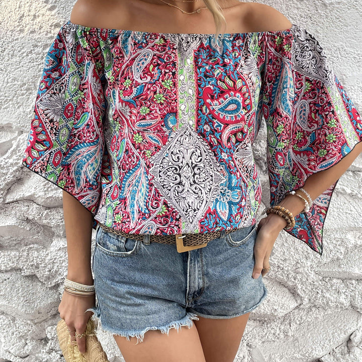 Polychrome Bohemian Sara™ Axelless Blouse by Emma & Rose Cape Town, featuring vibrant patterns and relaxed fit.