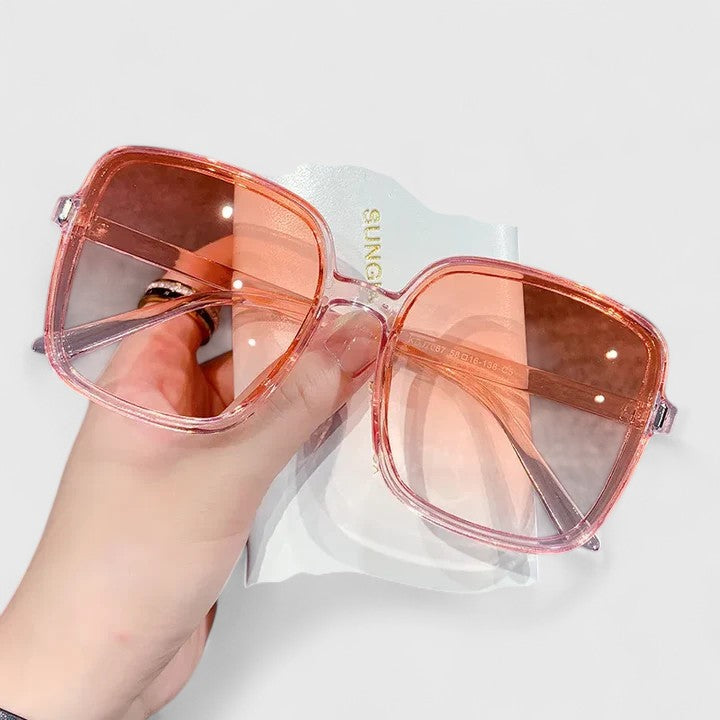 Emma & Rose Cape Town Destinie™ elegant sunglasses with blue tinted lenses and stylish frame, perfect for a sophisticated look.