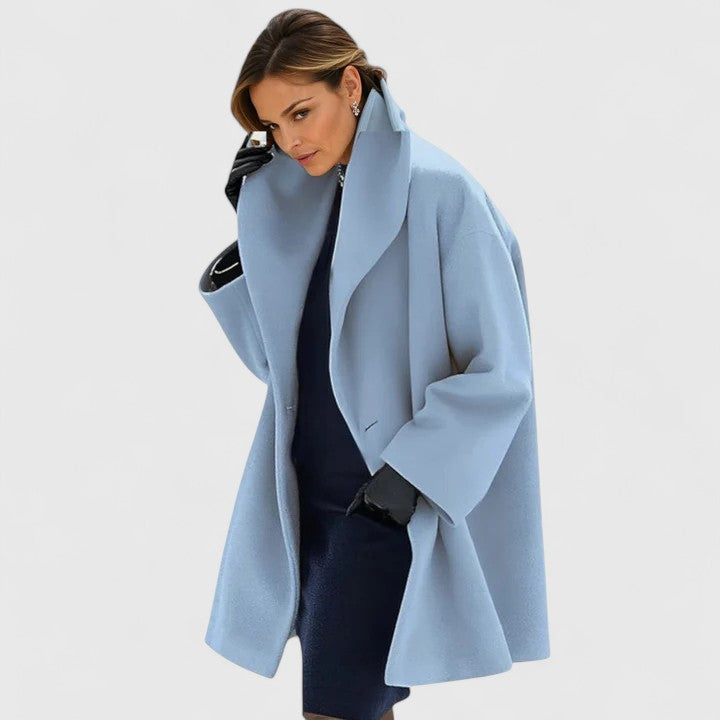 Emma & Rose Cape Town Oravienne™ elegant blue coat with tailored fit and stylish design, displayed on a hanger.