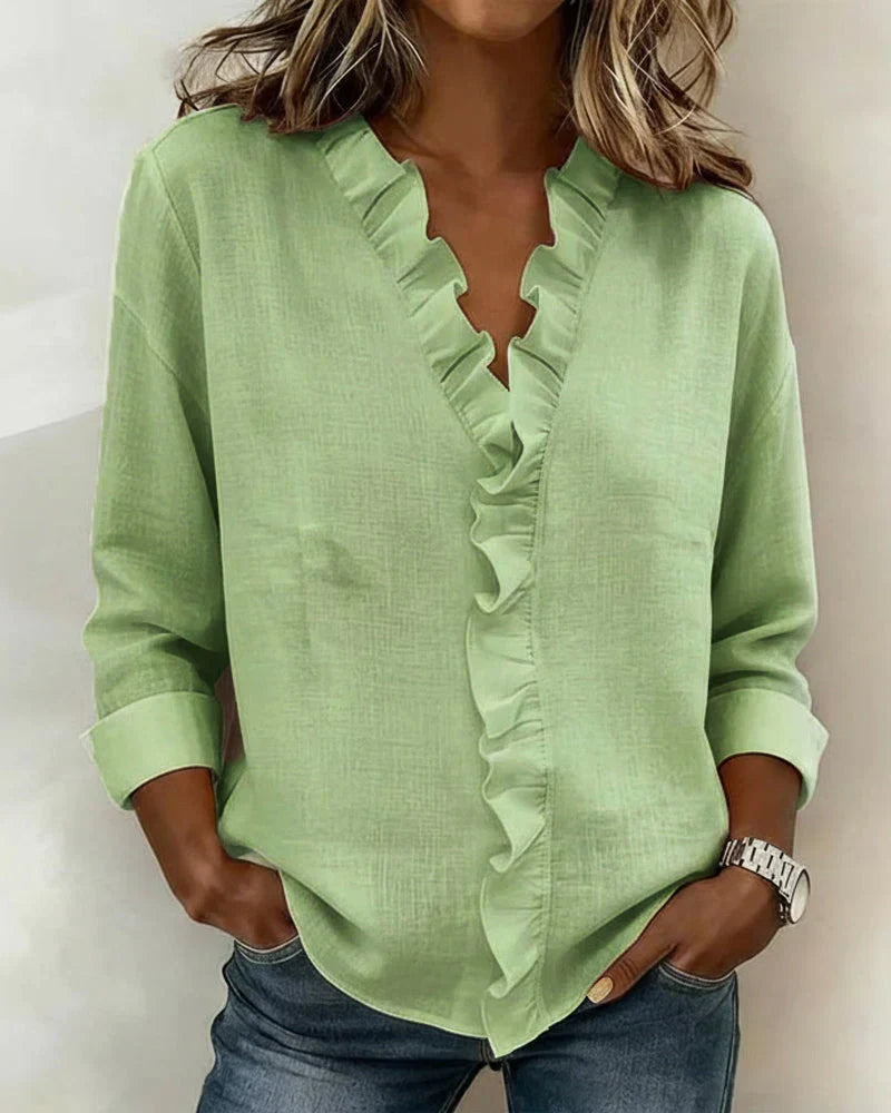 Emma & Rose Cape Town Yvonne V-neck blouse with blush rose color and ruffle details, front view.