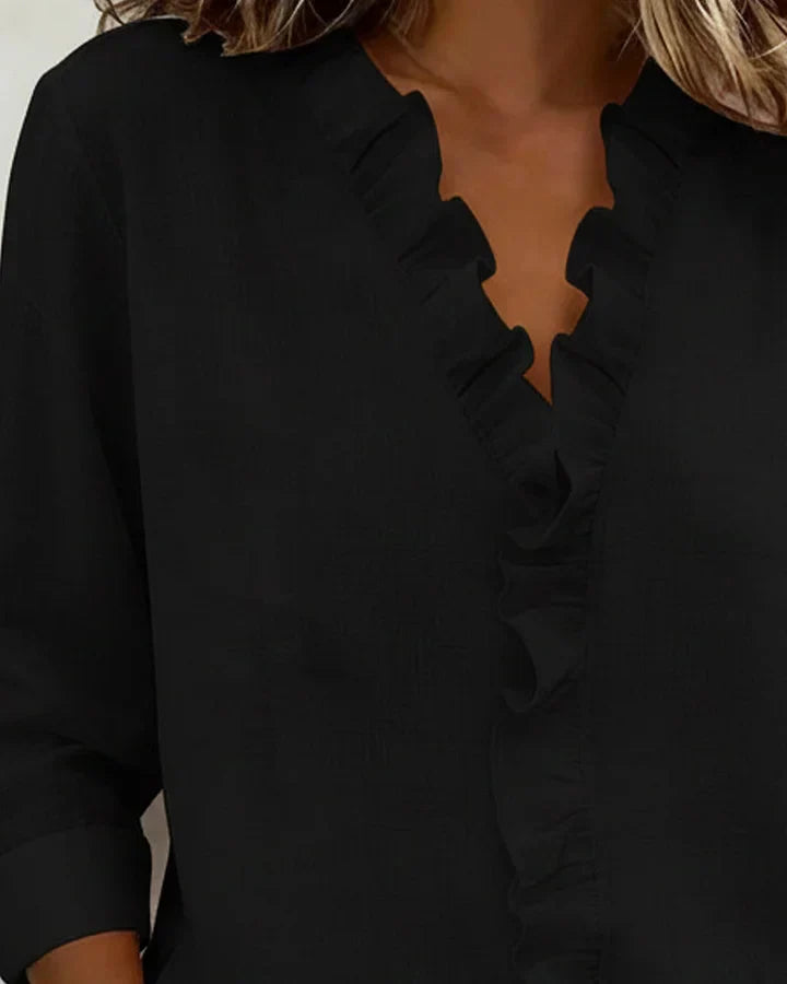 Blush pink Yvonne™ V-neck blouse with ruffles by Emma & Rose Cape Town, featuring elegant lightweight fabric and feminine design.