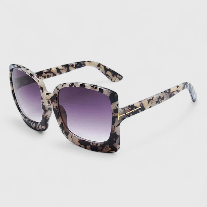 Brown Kynzlee stylish sunglasses by Emma & Rose Cape Town with rounded frames and tinted lenses.