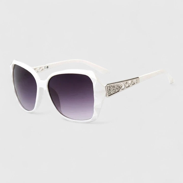 Emma & Rose Cape Town Avalynne™ sophisticated sunglasses with champagne-colored frames and dark tinted lenses.