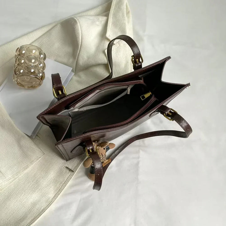 Dark brown Lena vintage vegan leather shoulder bag by Emma & Rose Cape Town, featuring a classic design and spacious interior.