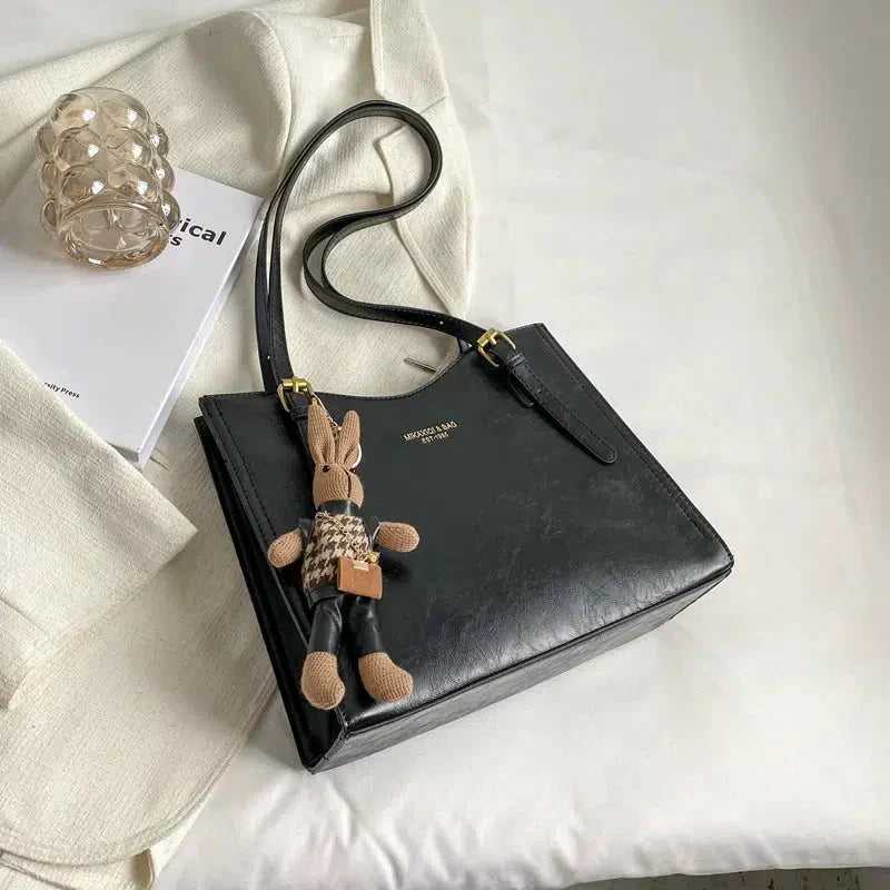 Dark brown Lena vintage vegan leather shoulder bag by Emma & Rose Cape Town, with adjustable strap and classic design.