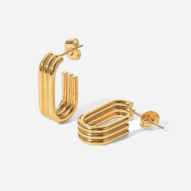 Charimelle™ 18K gold earrings by Emma & Rose Cape Town, showcasing elegant jewelry design with shiny gold finish.