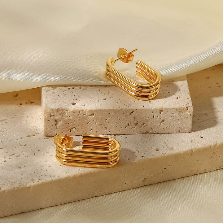 Emma & Rose Cape Town Charimelle 18K gold earrings, featuring elegant jewelry design with polished gold finish.