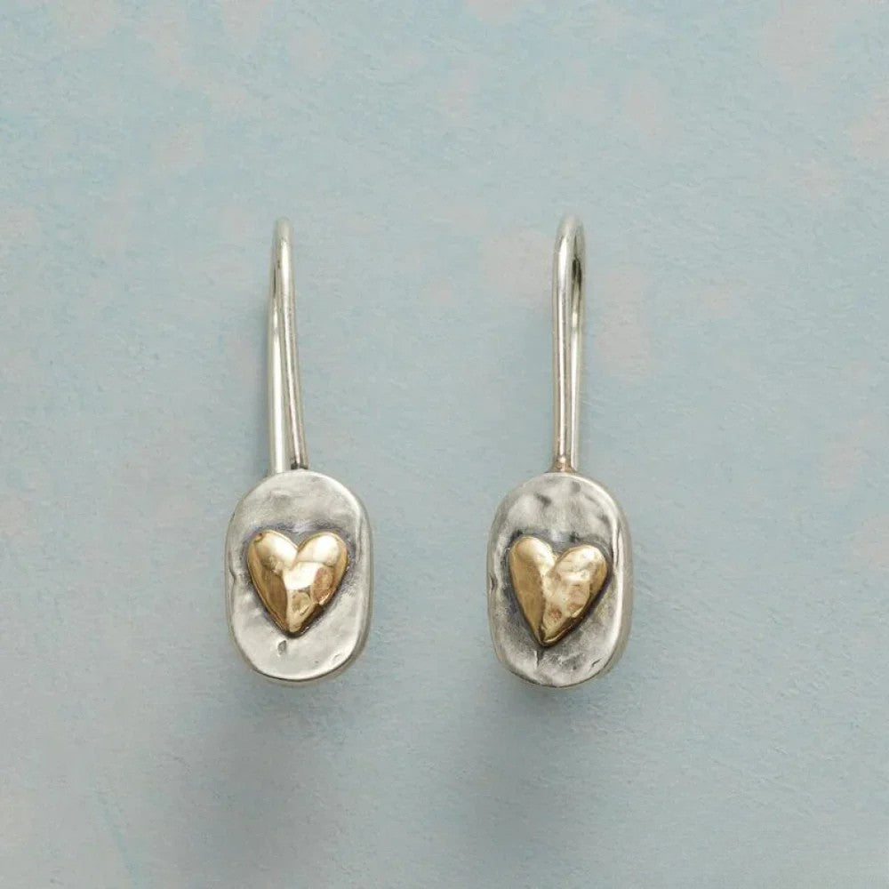 Paulien™ vintage silver earrings with heart design by Emma & Rose Cape Town, showcasing intricate craftsmanship and elegant style.
