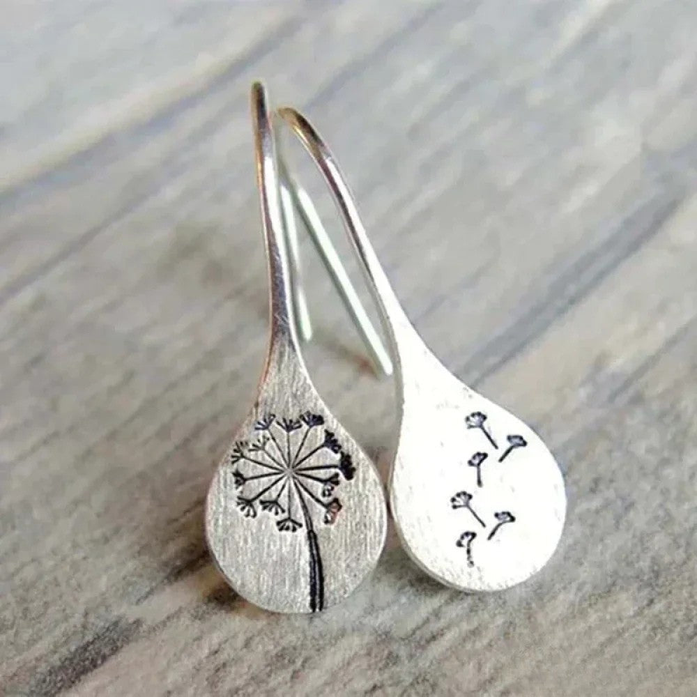 Elegant silver earrings from Emma & Rose Cape Town featuring a delicate and stylish design.