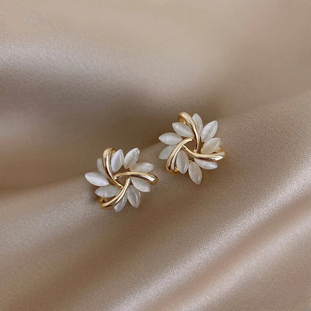 Emma & Rose Cape Town Katrien™ elegant gold earrings with intricate motifs, showcasing a stylish and refined jewelry design.