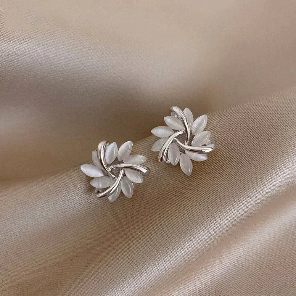 Elegant gold earrings with intricate motifs from Emma & Rose Cape Town's Katrien collection, displayed on a white background.