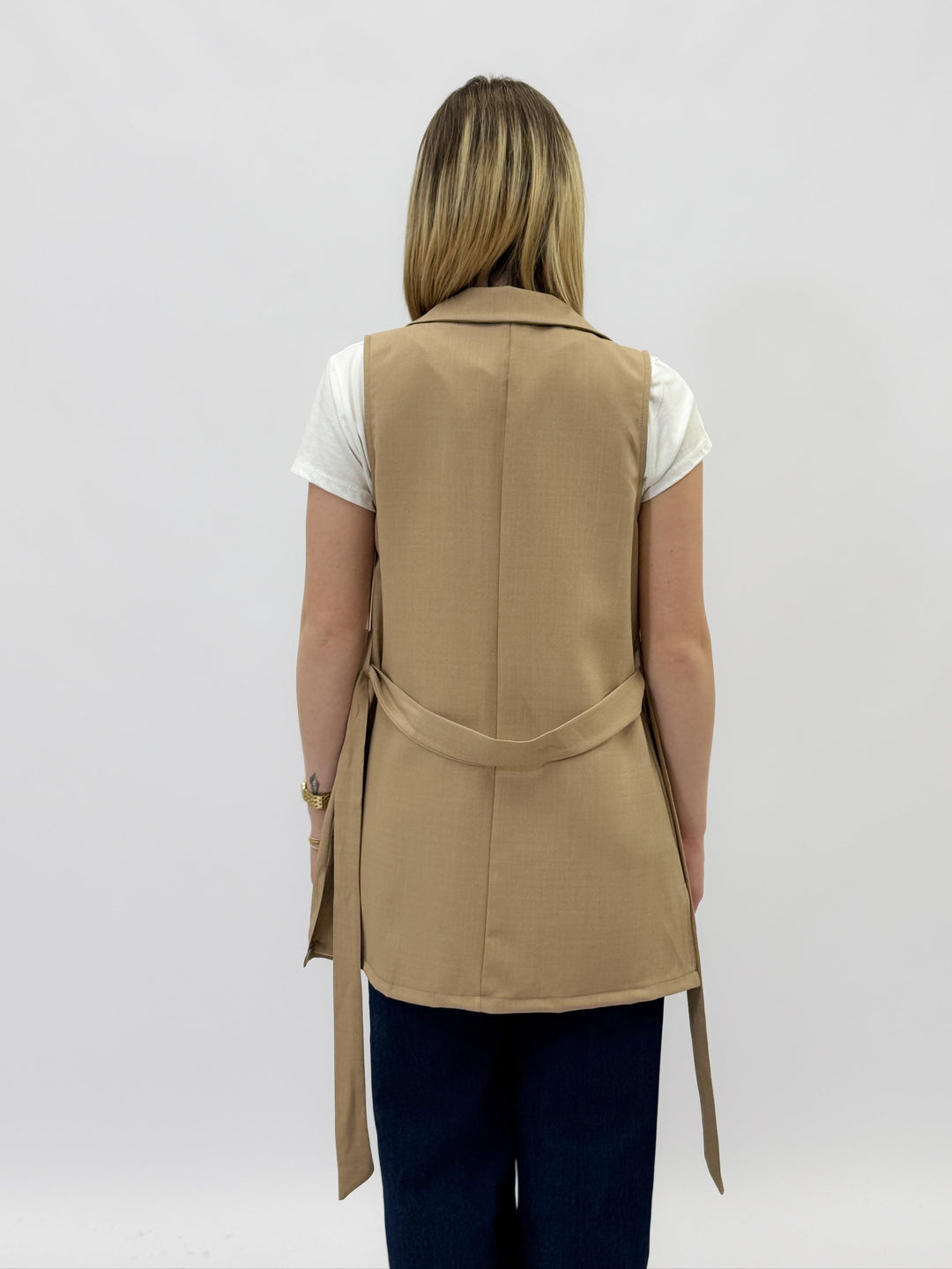 Black Plain™ gilet with belt by Emma & Rose Cape Town, stylish sleeveless jacket with belt detail in a close-up image.
