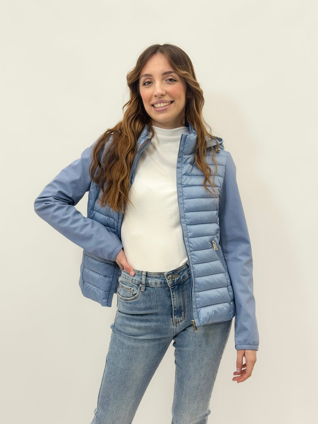 Light blue Lara™ ultra-lightweight puffer jacket by Emma & Rose Cape Town, showing close-up of quilted details and fabric texture.