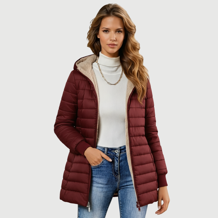 Emma & Rose Cape Town Vaelis™ elegant grey coat displayed hanging, showcasing its sophisticated design and tailored fit.