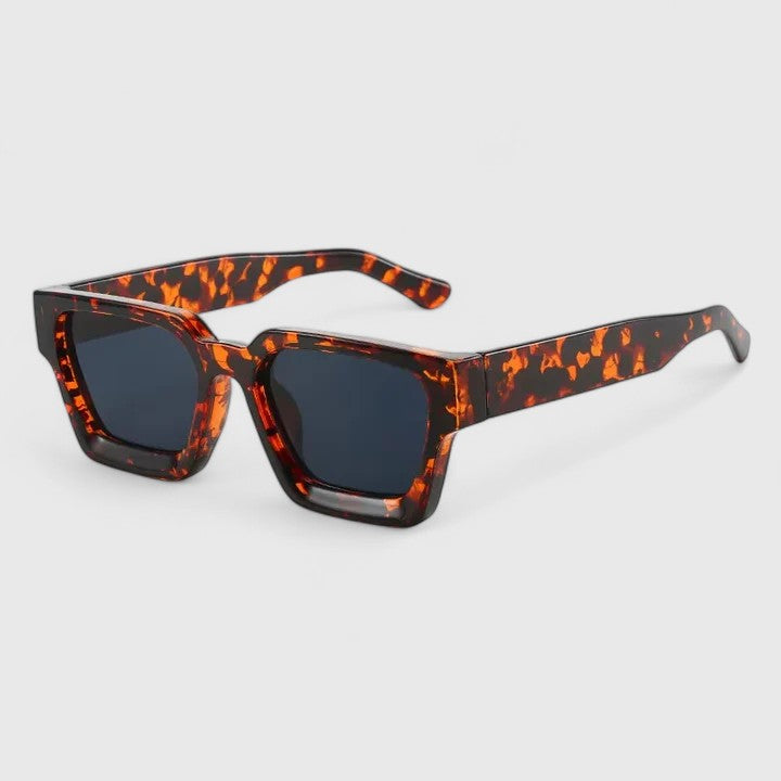 Emma & Rose Cape Town Izadora™ elegant sunglasses with leopard print frames and dark tinted lenses, stylish and sophisticated.