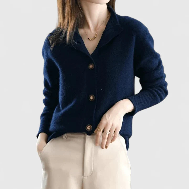 Beige Camaryllis™ Emma & Rose Cape Town elegant cardigan made of soft maglia fabric, displayed on a hanger.