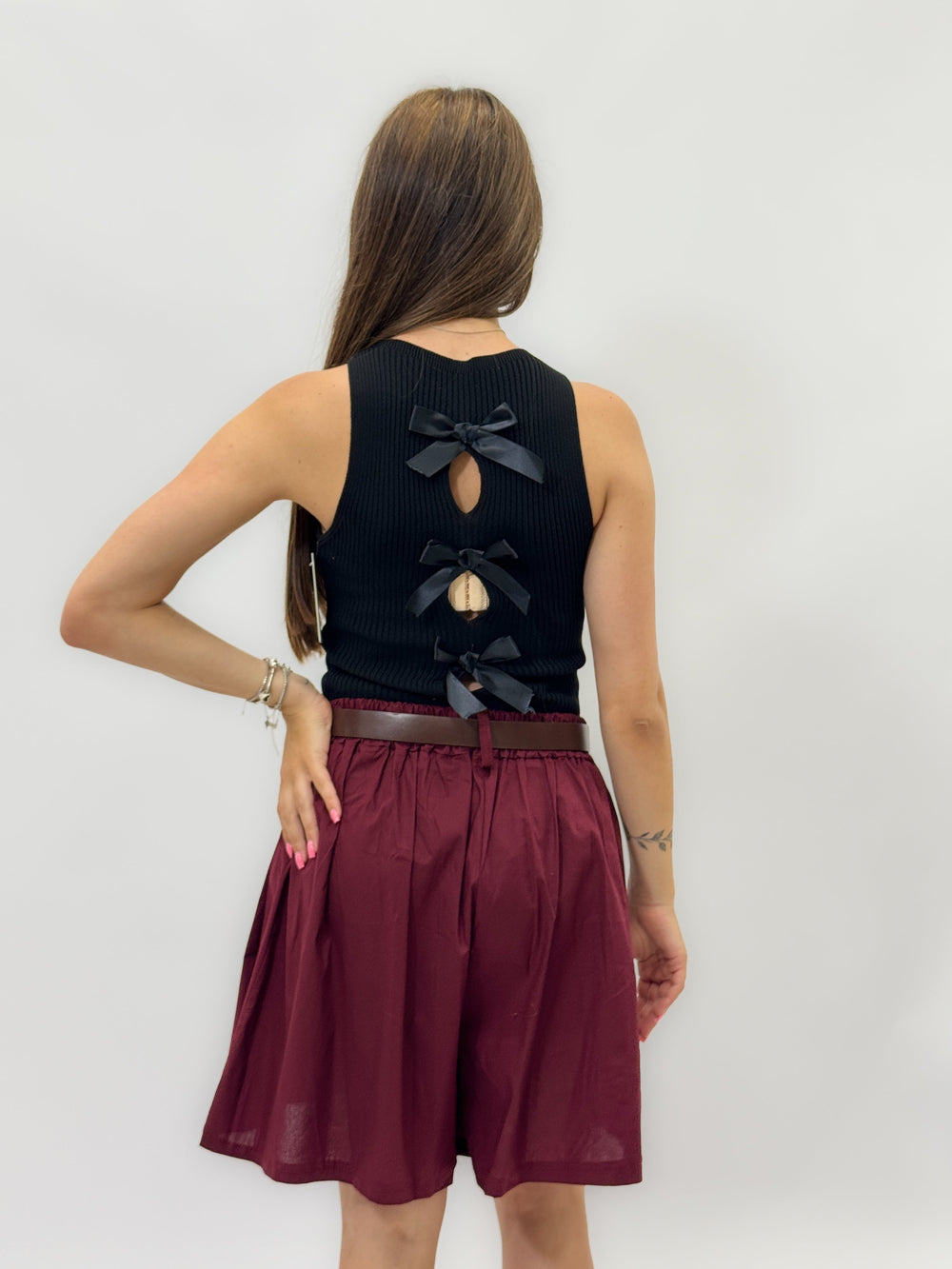 Black Ximena™ tank top by Emma & Rose Cape Town with bow details at the back, made from soft maglieria fabric.