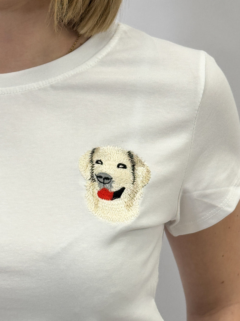 Zoë™ embroidered print T-shirt by Emma & Rose Cape Town, featuring colorful embroidered design on soft maglieria fabric.
