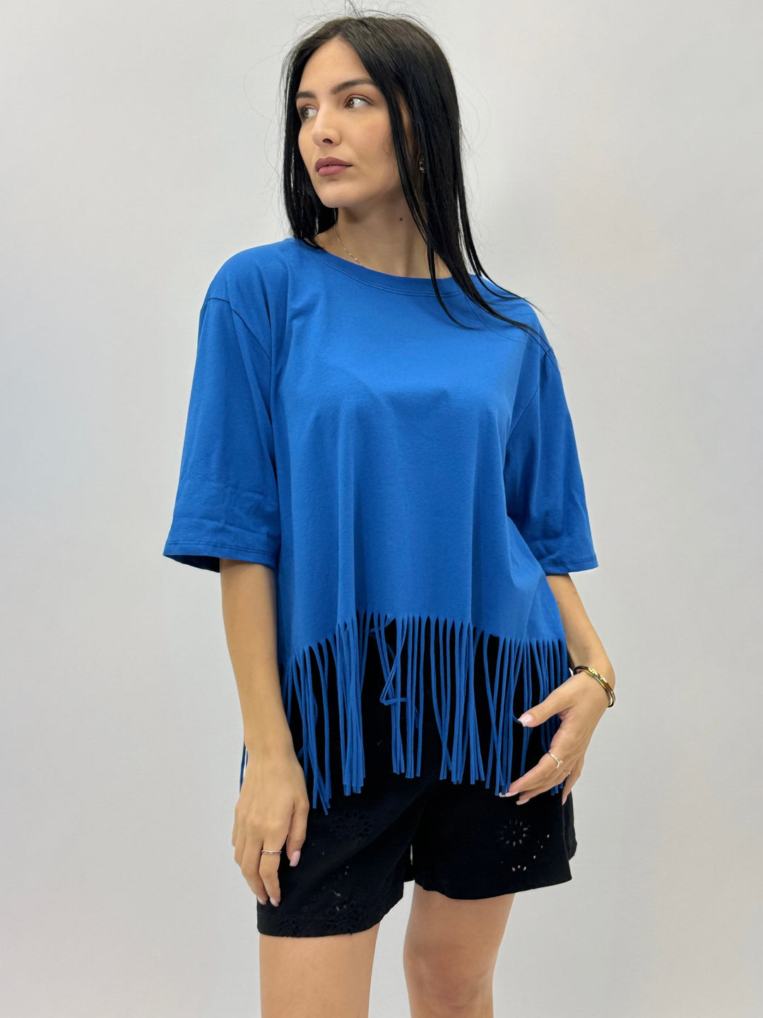 Light blue Plain™ T-shirt with fringes by Emma & Rose Cape Town, showcasing a casual maglieria style with playful fringe details.