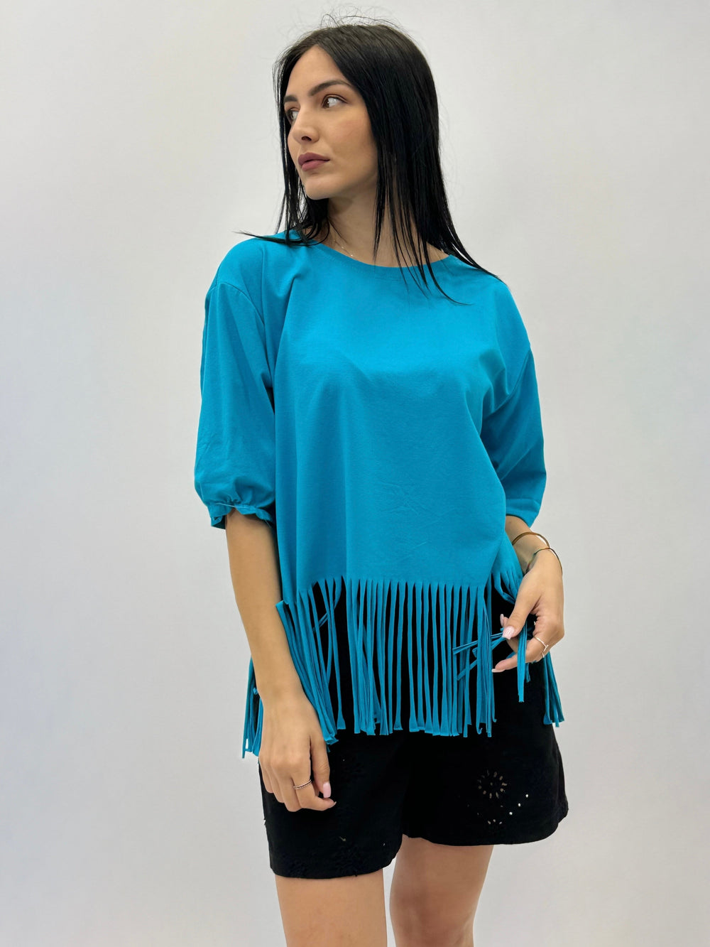 Light blue Plain™ T-shirt with fringes by Emma & Rose Cape Town, featuring a casual fit and stylish fringe details.