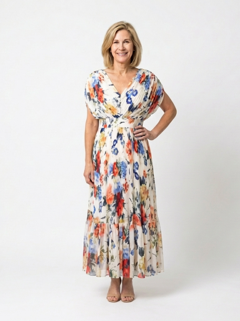 Multicolor Savannah™ pleated floral midi dress by Emma & Rose Cape Town, showcasing a flowy, patterned fabric and elegant design.
