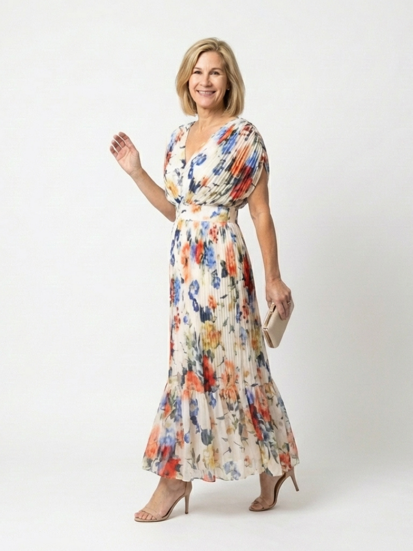 Emma & Rose Cape Town Savannah pleated floral midi dress with multicolor pattern, flowing fabric, and elegant design.