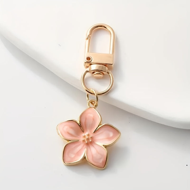 Pink Daisy™ backpack hanger by Emma & Rose Cape Town featuring a stylish flower design for easy bag hanging.
