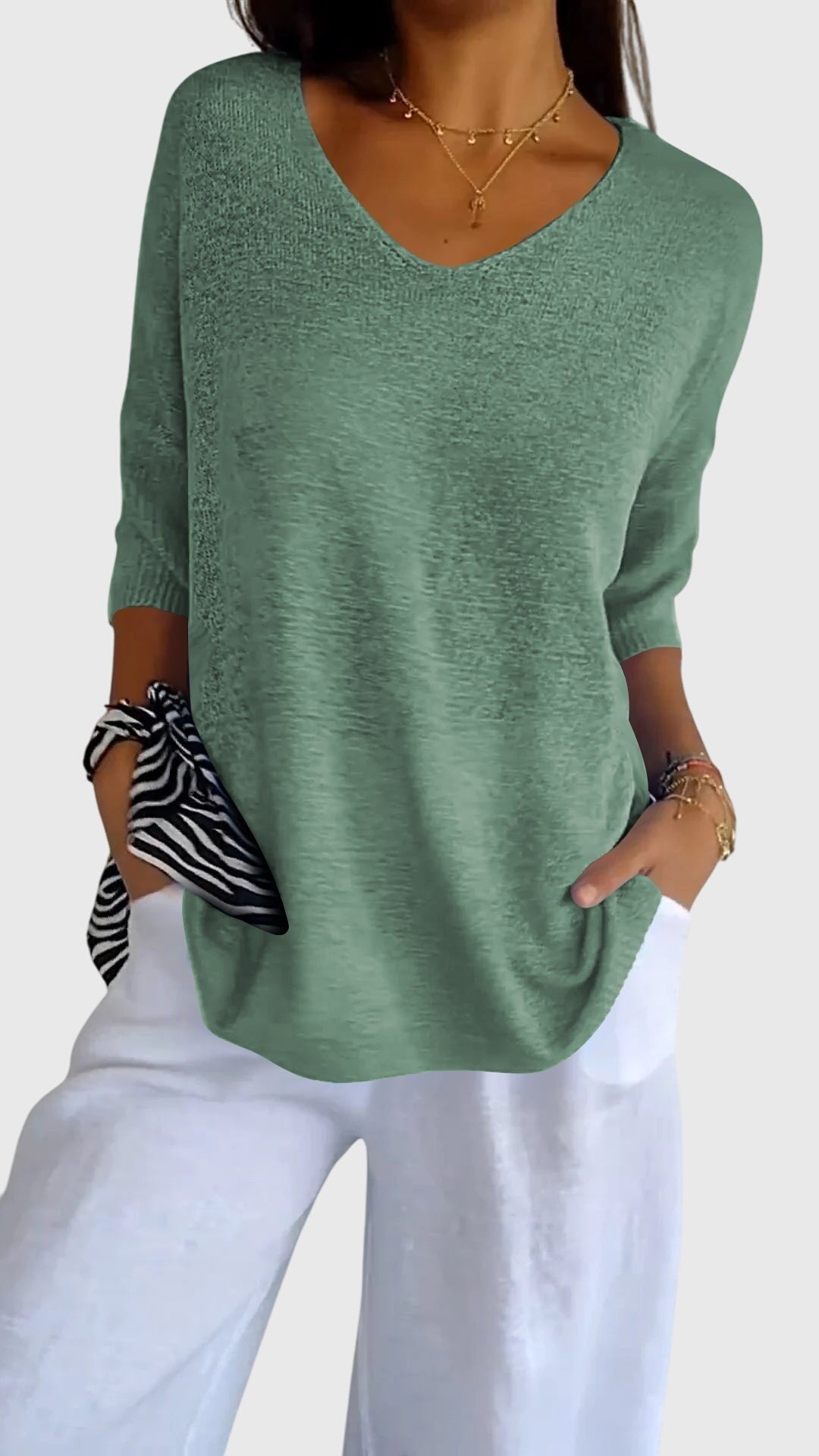 Red Cassandra™ elegant V-neck top by Emma & Rose Cape Town, featuring a stylish neckline and lightweight fabric.