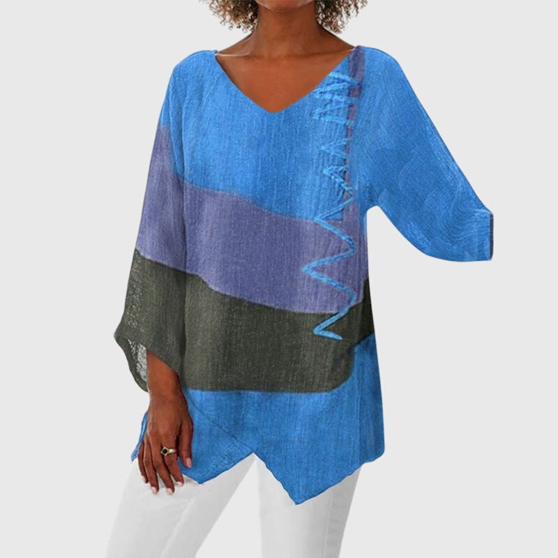 Red Nena™ flattering top by Emma & Rose Cape Town, shown on a hanger with a close-up of the fabric and design details.