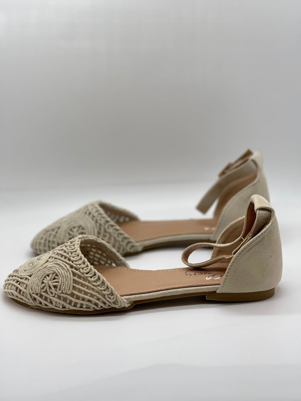 Beige Romy™ flat sandals by Emma & Rose Cape Town featuring soft luxurious fabrics and a comfortable slip-on design.